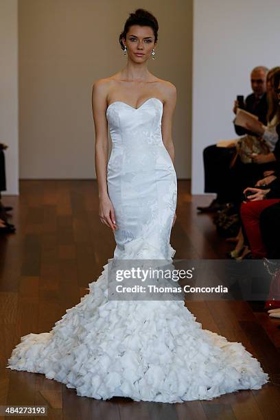 Model walks the runway wearing Isabelle Armstrong Spring 2015 Bridal collection at the Penthouse 45 on April 11, 2014 in New York City.