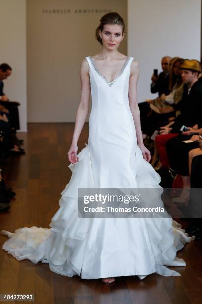 Model walks the runway wearing Isabelle Armstrong Spring 2015 Bridal collection at the Penthouse 45 on April 11, 2014 in New York City.