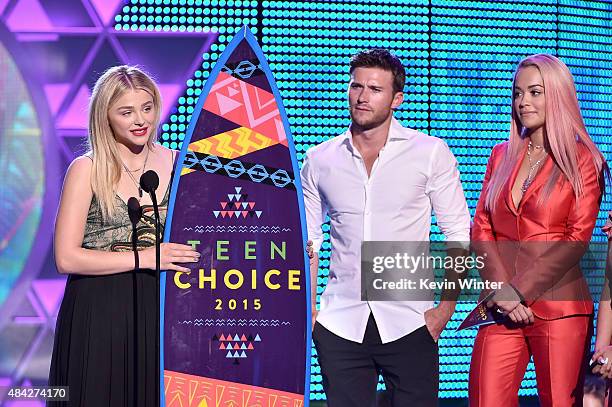 Actress Chloe Grace Moretz accepts the Choice Drama Movie Actress award from actor Scott Eastwood and singer Rita Ora onstage during the Teen Choice...