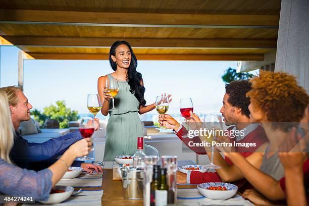 friends for dinner. - party host stock pictures, royalty-free photos & images