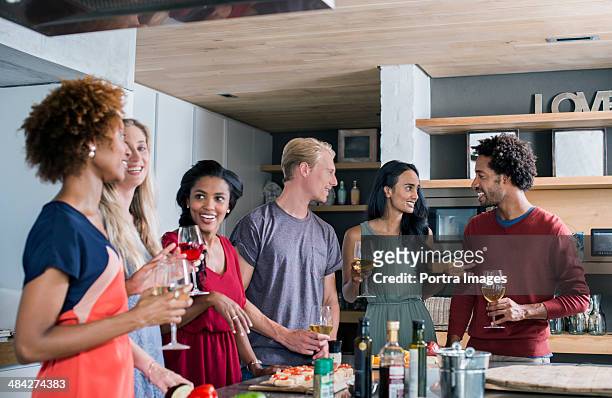 group of friends enjoying tim together - dinner party stock pictures, royalty-free photos & images