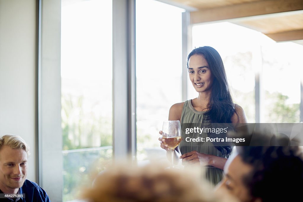 Woman hosting a dinner party