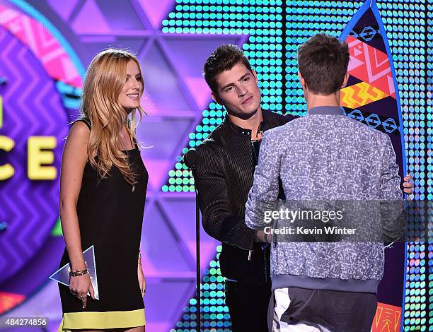 Actors Bella Thorne and Gregg Sulkin present internet personality Cameron Dallas with the Choice Web Star: Male Award onstage during the Teen Choice...