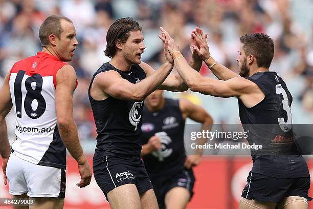 Marc Murphy of the Blues celebrates a goal with Bryce Gibbs during the round four AFL match between the Carlton Blues and the Melbourne Demons at...