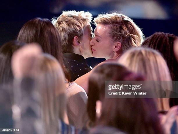 Show host Ellen DeGeneres and actress Portia de Rossi kiss in the audience during the Teen Choice Awards 2015 at the USC Galen Center on August 16,...