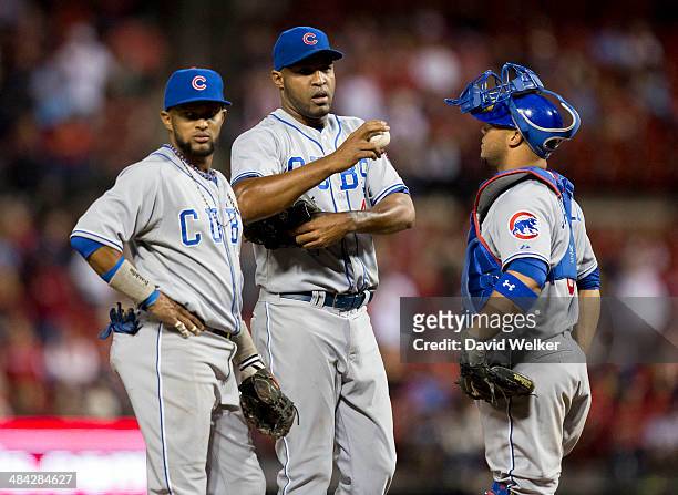 Jose Veras of the Chicago Cubs talks with Welington Castillo on the mound in the eighth inning during a game against the St. Louis Cardinals at Busch...