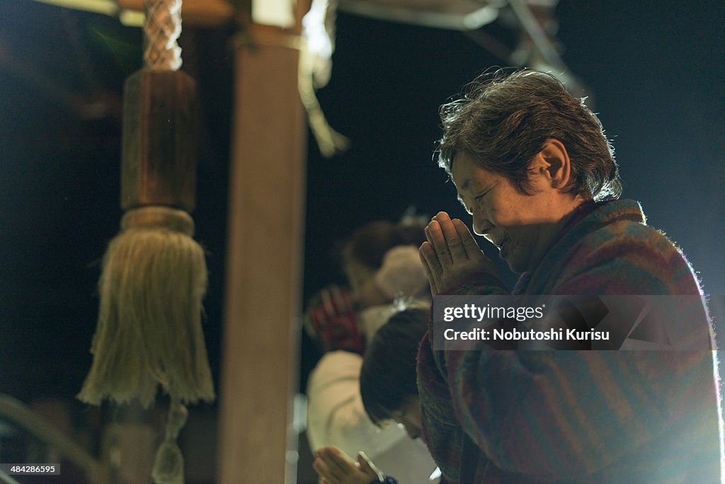 One woman praying at the shrine