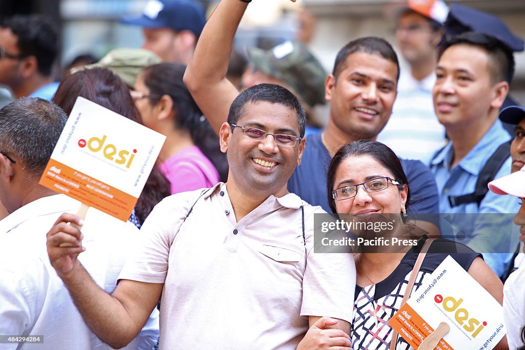 Parade watchers with DESI promotional fans. The Federation...