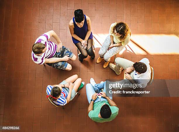 student meeting in library - teamwork - people business meeting birdseye stock pictures, royalty-free photos & images