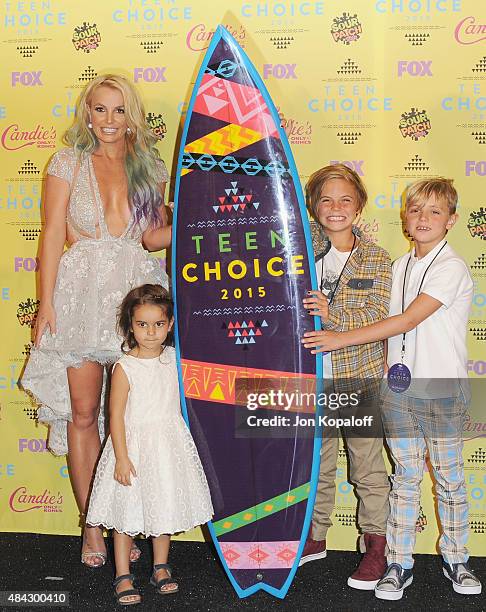 Singer Britney Spears and kids pose in the press room at the Teen Choice Awards 2015 at Galen Center on August 16, 2015 in Los Angeles, California.