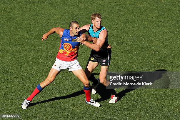 Trent West of the Lions competes with Matthew Lobbe of the Power during the round 4 AFL game between Port Adelaide and the Brisbane Lions at Adelaide...