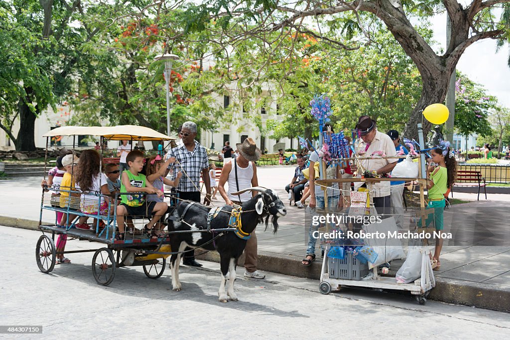 Cuban everyday scenes: The goat ride for children in Leoncio...