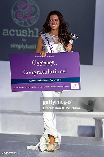 Miss Liverpool Jennifer McSween walks the runway during the finals of Miss England 2015 at The Ricoh Arena on August 14, 2015 in Coventry, England.