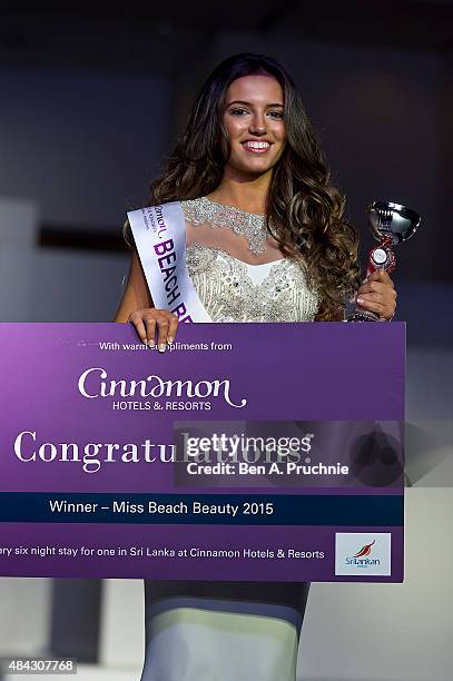 Miss Liverpool Jennifer McSween walks the runway during the finals of Miss England 2015 at The Ricoh Arena on August 14, 2015 in Coventry, England.