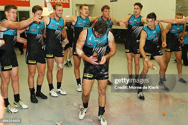 Power players celebrate in the changerooms with first time player Sam Gray after the round 4 AFL game between Port Adelaide and the Brisbane Lions at...