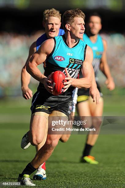 Matt White of the Power runs with the ball during the round 4 AFL game between Port Adelaide and the Brisbane Lions at Adelaide Oval on April 12,...