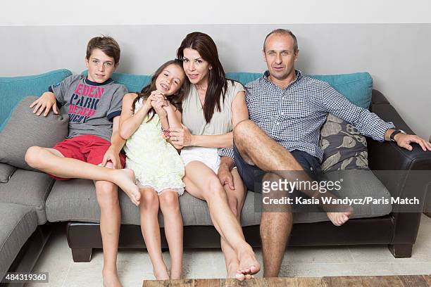 Former player and rugby coach Philippe Saint-Andre is photographed with his wife Patricia and their children Jules and Paloma at their home for Paris...