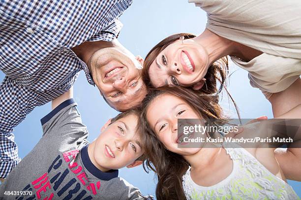 Former player and rugby coach Philippe Saint-Andre is photographed with his wife Patricia and their children Jules and Paloma at their home for Paris...