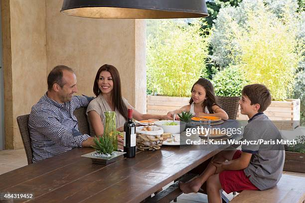 Former player and rugby coach Philippe Saint-Andre is photographed with his wife Patricia and their children Jules and Paloma at their home for Paris...