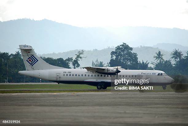 Trigana Air passenger plane arrives at Jayapura airport on August 17, 2015 as the local carrier continues operations while the National Search and...