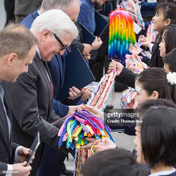 Children present Hiroshima Paper Cranes to German Foreign Minister Frank-Walter Steinmeier during his visit to the monument for the 1945 atomic bomb...