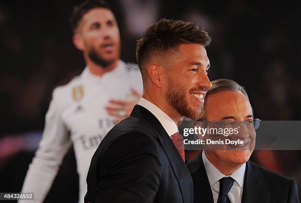 Sergio Ramos of Real Madrid smiles along with Real president Florentino Perez during a press conference to announce Ramos' new five-year contract...