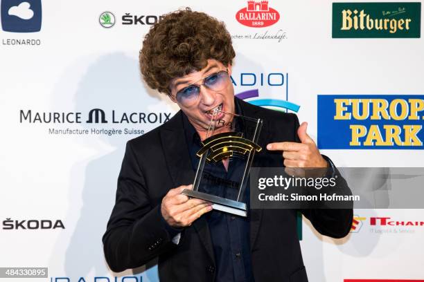 Atze Schroeder poses with his award prior to the Radio Regenbogen Award 2014 on April 11, 2014 in Rust, Germany.