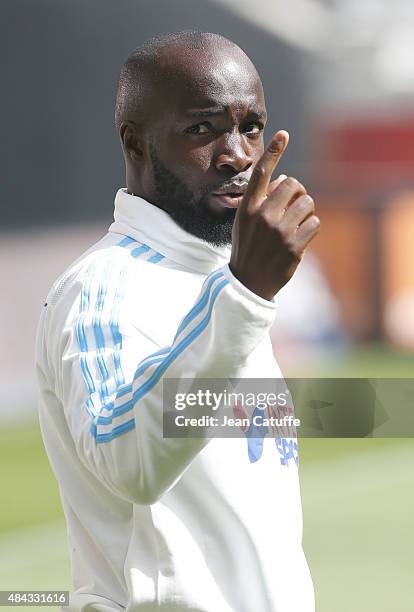 Lassana Diarra of OM who didn't play warms up after the French Ligue 1 match between Stade de Reims and Olympique de Marseille at Stade Auguste...