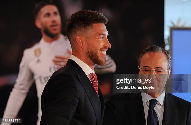 Sergio Ramos of Real Madrid as he stands next to Real president Florentino Perez during a press conference to announce Ramos' new five-year contract...