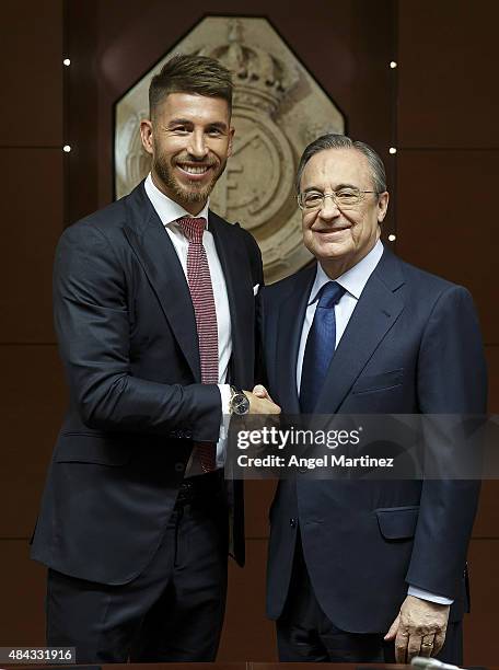 Sergio Ramos of Real Madrid poses with Real president Florentino Perez after signs his new five-year contract at the Santiago Bernabeu stadium on...