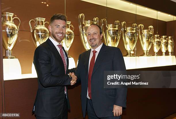 Sergio Ramos of Real Madrid poses with head coach Rafael Benitez after signs his new five-year contract at the Santiago Bernabeu stadium on August...