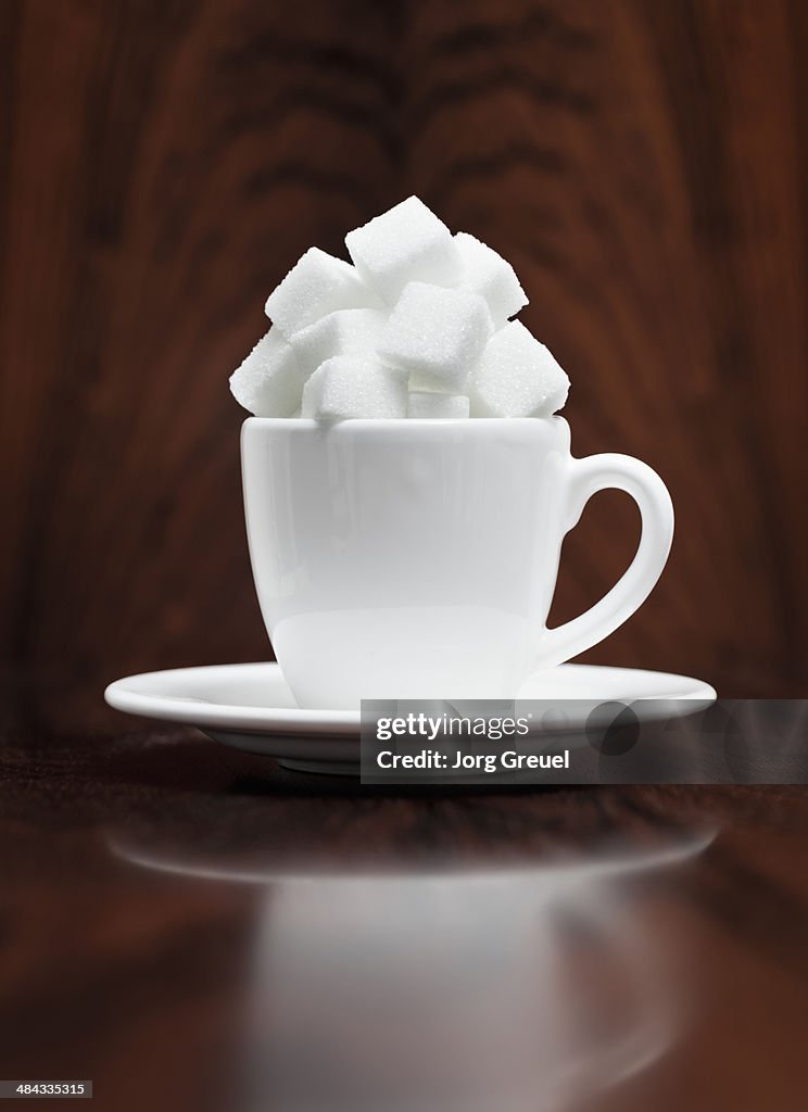 Sugar cubes in an espresso cup