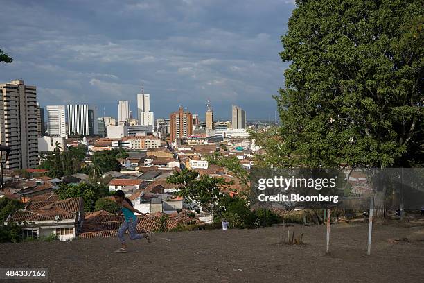 Young girl runs in the San Antonio Church Park in Cali, Colombia, on Wednesday, Aug. 12, 2015. Colombia's central bank last month cut its forecast...