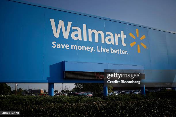 Signage is displayed outside of the Wal-Mart Stores Inc. Headquarters building in Bentonville, Arkansas, U.S., on Wednesday, July 29, 2015. Wal-Mart...