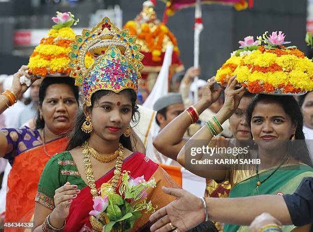 Members of the Indian expatriate community in the United Arab Emirates gather at the Dubai Cricket Stadium during a speech by their Prime Minister...