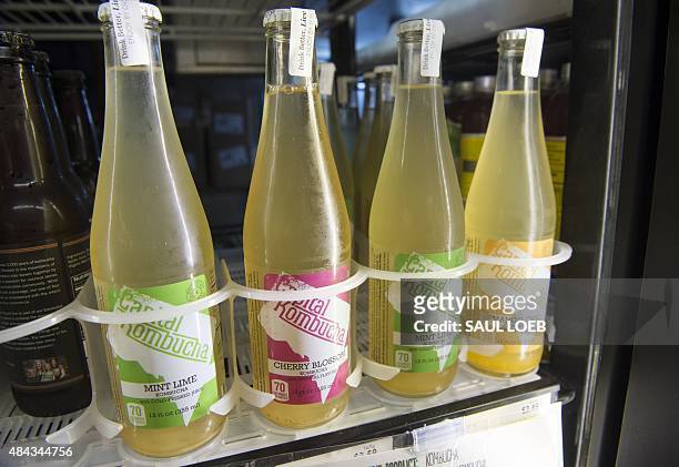 Bottles of kombucha, a fermented tea that originated in China, are seen for sale at a store in Washington, DC, August 12, 2015. AFP PHOTO / SAUL LOEB