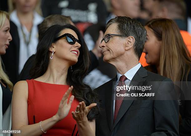 Liverpool's US owner John W. Henry and his wife Linda Pizzuti are pictured before the start of the English Premier League football match between...