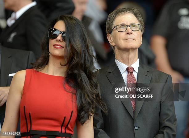 Liverpool's US owner John W. Henry and his wife Linda Pizzuti are pictured before the start of the English Premier League football match between...