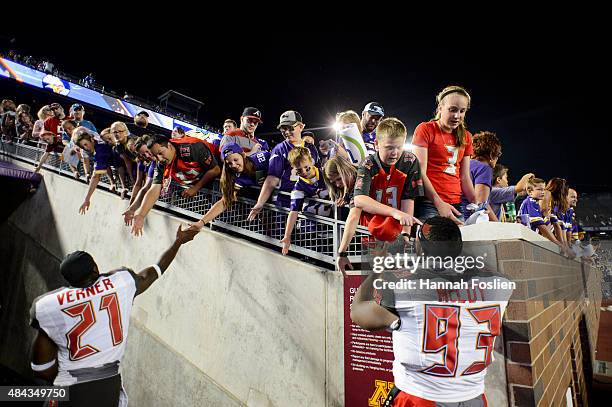 Alterraun Verner and Gerald McCoy of the Tampa Bay Buccaneers walk off the field after the preseason game against the Minnesota Vikings on August 15,...