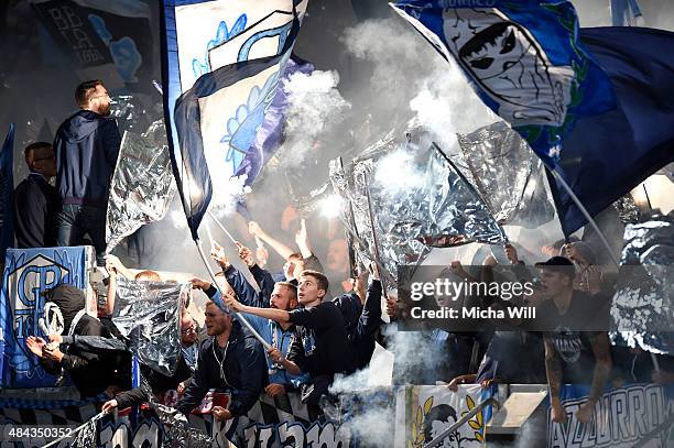 The fans of TSV 1860 Muenchen burn fireworks during the second Bundesliga match between 1. FC Nuernberg and TSV 1860 Muenchen at Grundig-Stadion on...