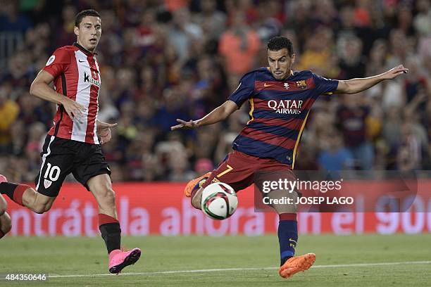 Barcelona's forward Pedro Rodriguez vies with Athletic Bilbao's midfielder Oscar de Marcos during the Spanish Supercup second-leg football match FC...