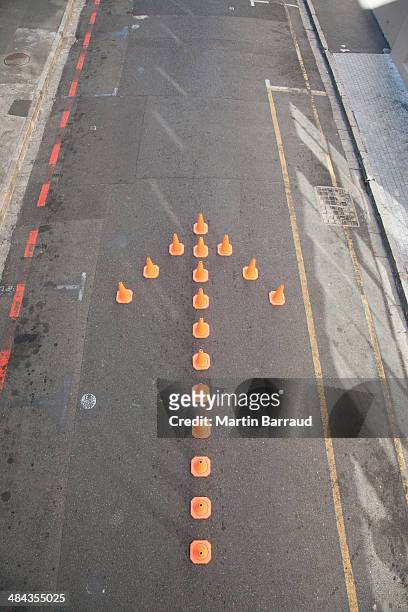 traffic cones in arrow-shape - traffic cone stock pictures, royalty-free photos & images