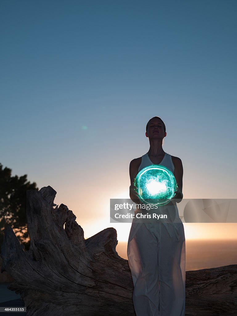 Woman holding an orb