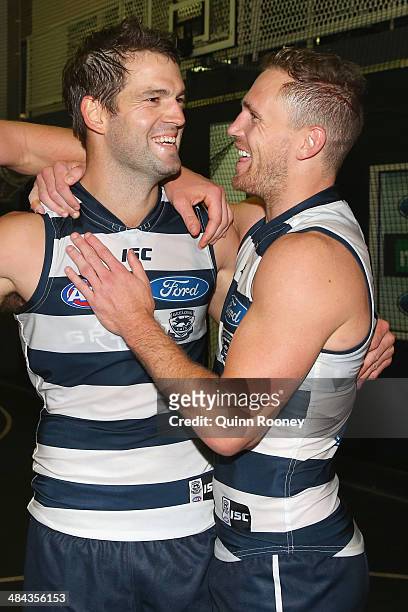 Jared Rivers and Joel Selwood of the Cats celebrate in the rooms after winning the round four AFL match between the Geelong Cats and the West Coast...