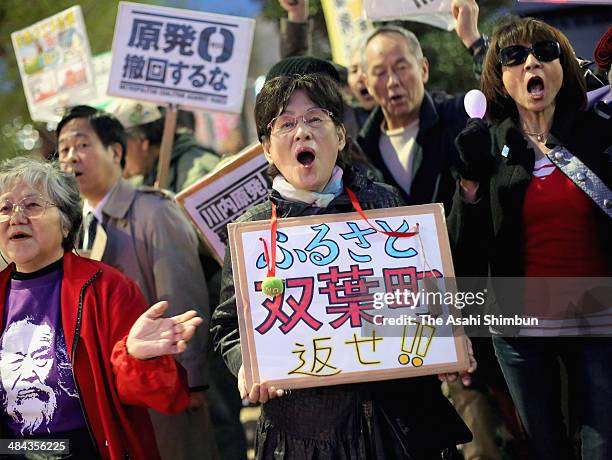 Protesters march on near the Prime Minister's official residence on April 11, 2014 in Tokyo, Japan. The new basic energy plan, approved by the...