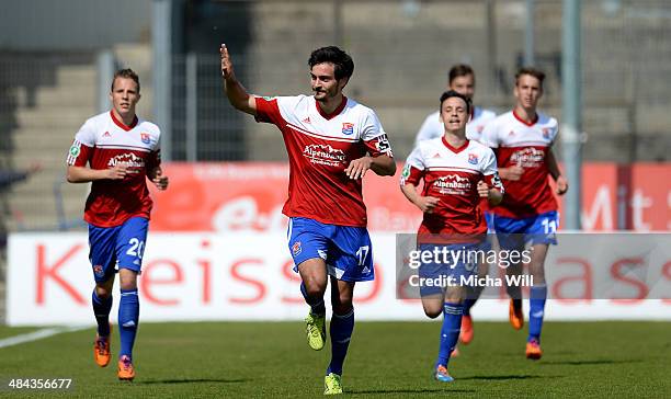 Jonas Hummels of Unterhaching celebrates with team-mates after scoring his team's second goal during the Third League match between SpVgg...