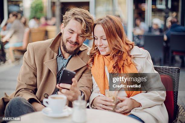 junges paar genießen sie im café im herbst. - couple in cafe man beard coffee stock-fotos und bilder