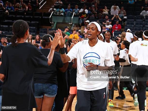 Swin Cash of the New York Liberty hi fives fans before a game against the Tulsa Shock on August 15, 2015 at Madison Square Garden, New York City ,...