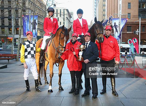Blake Shinn,Nikki Phillips,Nic Westaway and Darren Beadman pose with the Melbourne Cup at Martin Place on August 18, 2015 in Sydney, Australia.