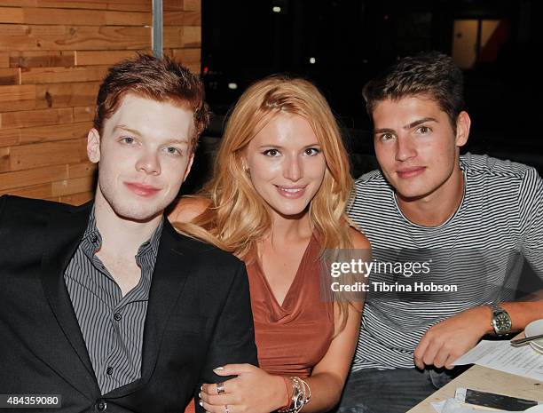 Cameron Monaghan, Bella Thorne and Gregg Sulkin attend Monaghan's birthday dinner at The District by Hannah An on August 15, 2015 in Los Angeles,...